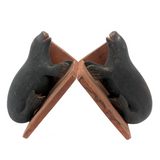 Inuit Carved Wood Sea Lion Bookends with Bared Teeth, a Pair