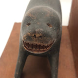 Inuit Carved Wood Sea Lion Bookends with Bared Teeth, a Pair