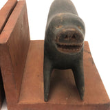 Inuit Carved Wood Sea Lion Bookends with Bared Teeth, a Pair