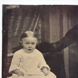 Young Child with Mother's Arm and Patterned Drape, Antique Tintype