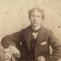 Young Man in Folk Art Chair, Antique Cabinet Card in Period Repousse Easel Frame