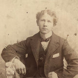 Young Man in Folk Art Chair, Antique Cabinet Card in Period Repousse Easel Frame