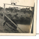 Woman on High Pointing Rifle, Old Snapshot Photo