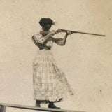 Woman on High Pointing Rifle, Old Snapshot Photo