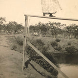 Woman on High Pointing Rifle, Old Snapshot Photo