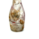 Quality For Over A Century, Painterly and Evocative Old Fire Tossed Glass Milk Bottle