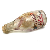 Quality For Over A Century, Painterly and Evocative Old Fire Tossed Glass Milk Bottle
