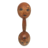 Old Wooden Barbell with Hand-drawn Faces