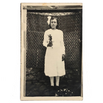 Serious Young Woman in Front of Linsey Woolsey Textile, Antique RPPC