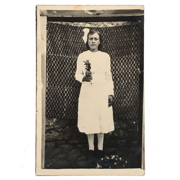 Serious Young Woman in Front of Linsey Woolsey Textile, Antique RPPC