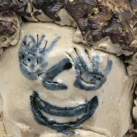 Smiling Bright Eyed Pottery Kid