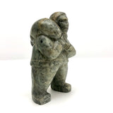 Inuit Soapstone Carving Of Man Carrying Seal, Signed