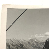Woman in Sunglasses and Saddle Shoes on Banff Chairlift, 1960