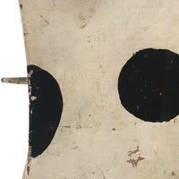 Old Black and Spotted Wooden Dog on Wheel