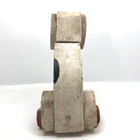 Old Black and Spotted Wooden Dog on Wheel