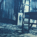 Woman in Parlor Behind Beaded Curtain, 1909 British Cyanotype