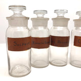 Glass Apothecary Bottles with Handwritten Labels from Houle's Pharmacy, Lowell, MA