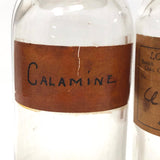 Glass Apothecary Bottles with Handwritten Labels from Houle's Pharmacy, Lowell, MA