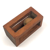 Geometric Carved Ball in Cage Whimsy