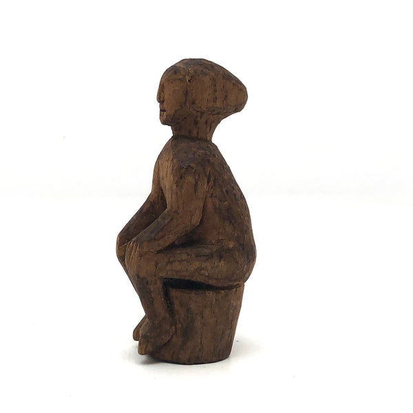 Old Carved Seated Figure on Stump