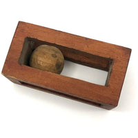 Geometric Carved Ball in Cage Whimsy