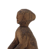 Old Carved Seated Figure on Stump
