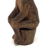 Old Carved Seated Figure on Stump