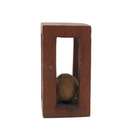 Geometric Carved Ball in Cage Whimsy