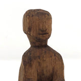Old Carved Seated Figure on Stump
