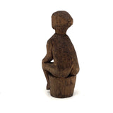 Old Carved Seated Figure on Stump