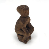 Old Carved Seated Figure on Stump