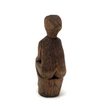 Old Carved Seated Figure on Stump