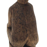 Old Carved Seated Figure on Stump