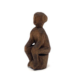 Old Carved Seated Figure on Stump