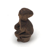 Old Carved Seated Figure on Stump