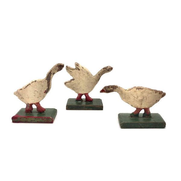Three Old German Painted Wooden Geese on Green Bases