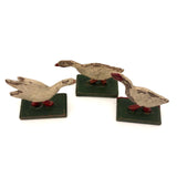 Three Old German Painted Wooden Geese on Green Bases