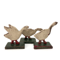 Three Old German Painted Wooden Geese on Green Bases
