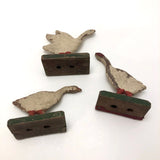 Three Old German Painted Wooden Geese on Green Bases