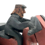 Hard-carved Man in Black with Mullet on (Three-wheeled) Motorcycle