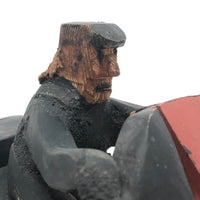 Hard-carved Man in Black with Mullet on (Three-wheeled) Motorcycle