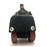 Hard-carved Man in Black with Mullet on (Three-wheeled) Motorcycle