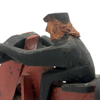 Hard-carved Man in Black with Mullet on (Three-wheeled) Motorcycle