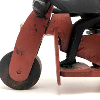 Hard-carved Man in Black with Mullet on (Three-wheeled) Motorcycle