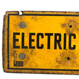 Battered Old Electric Fence Sign Mounted to Wood Block