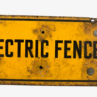 Battered Old Electric Fence Sign Mounted to Wood Block