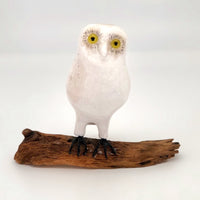 White Folk Art Owl with Bright Yellow Eyes on Driftwood