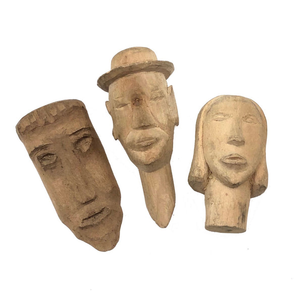 Three Little Carved Wooden Heads