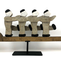 Figures Marching Down an Arrow, Old Wooden Folk Art Sculpture on Stand