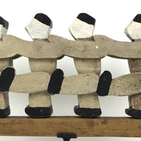 Figures Marching Down an Arrow, Old Wooden Folk Art Sculpture on Stand